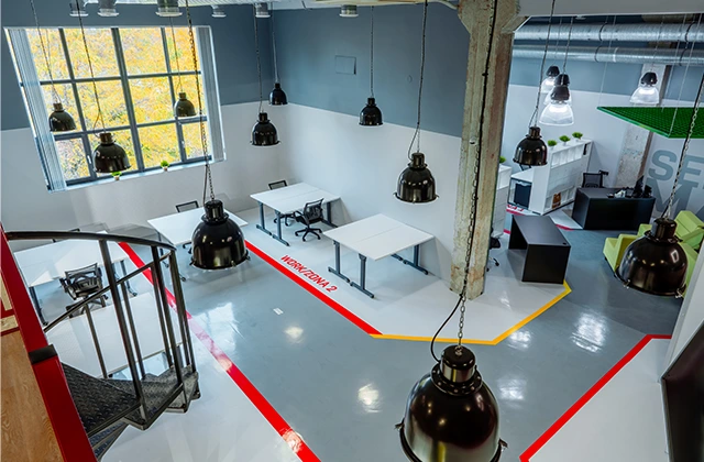 Space with lighting controlled by presence and daylight sensors